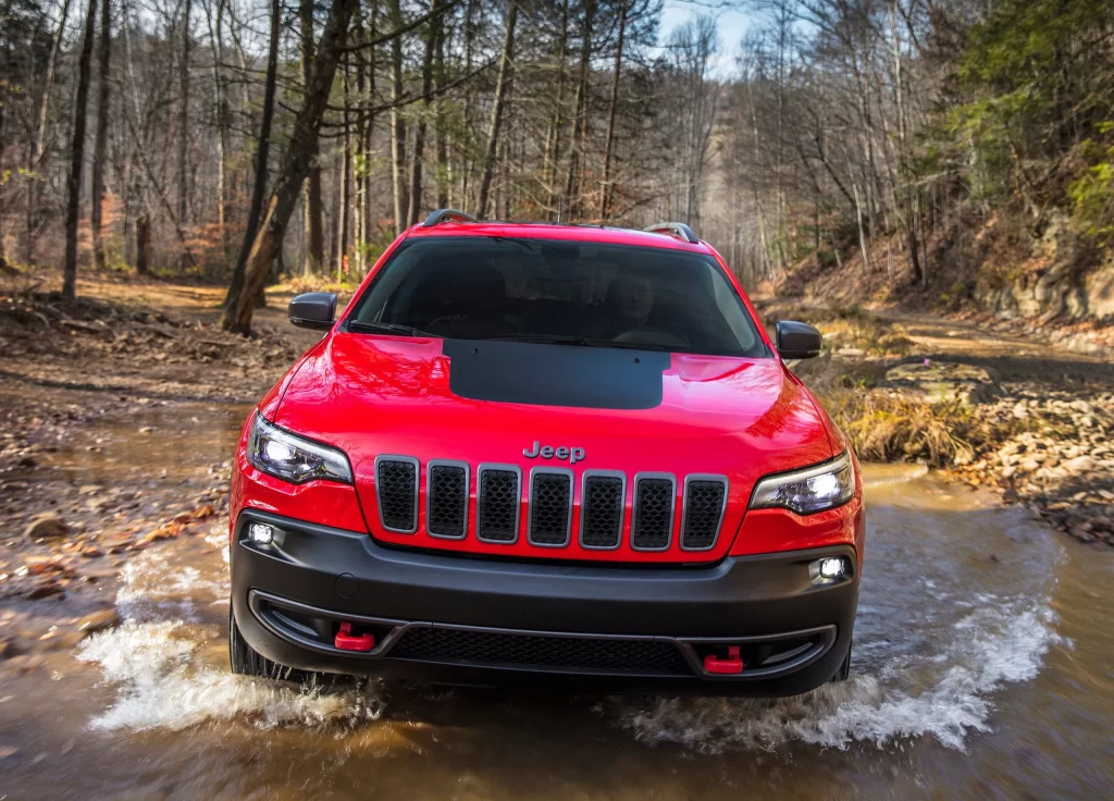 Red Jeep Cherokee Shallow Water Crossing