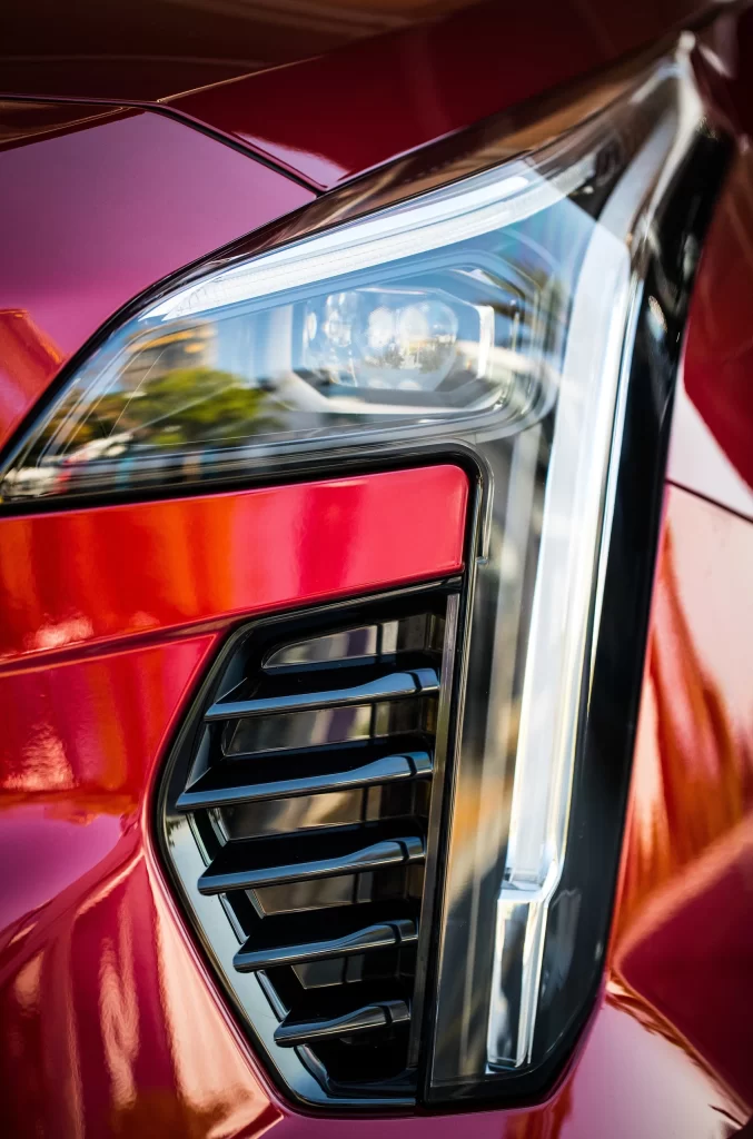 Red Sedan LED Headlight Close Up Detail