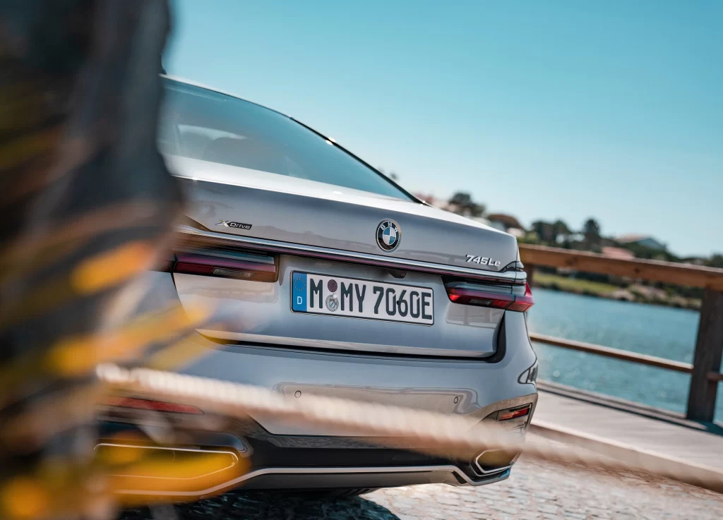 Silver BMW 745Le Sedan Waterside Rear View