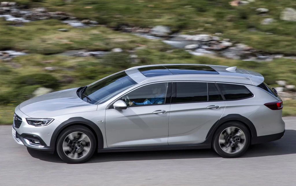 Silver Opel Wagon Side Road View