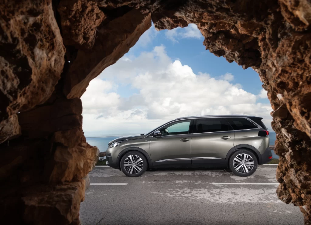Silver Peugeot SUV Rocky Outcrop Side View