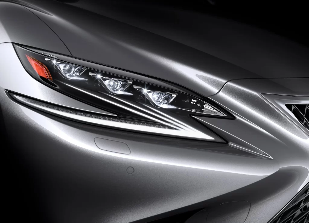 Silver Sedan Headlight Auto Leveling Detail