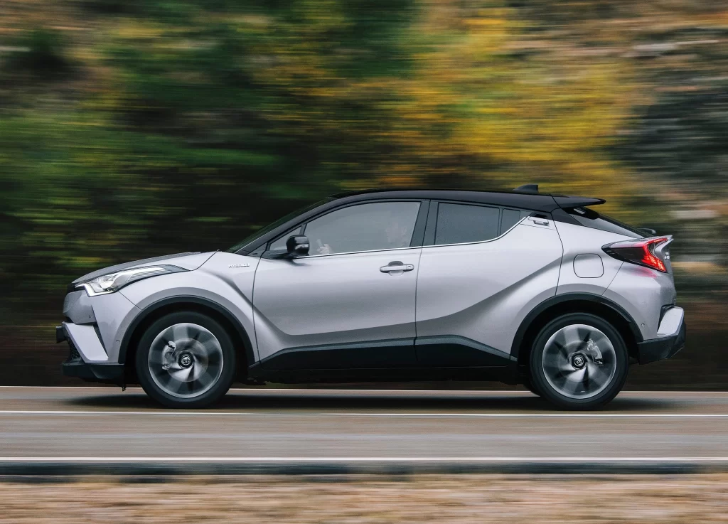 Silver Toyota SUV Road Motion Side View