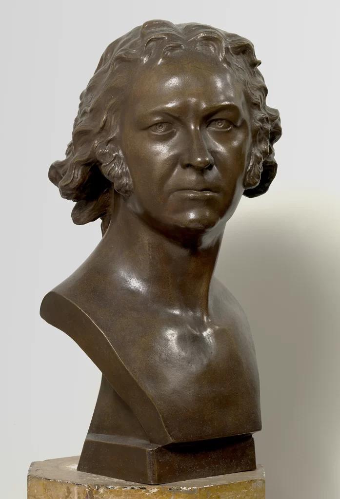 Bronze Man Bust Curly Hair Light Background