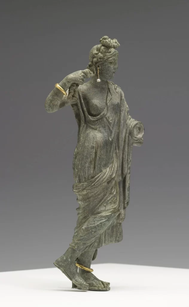 Bronze Draped Woman Statue Gray Background