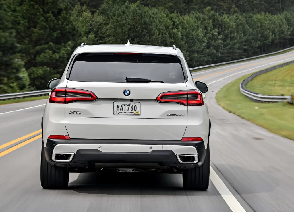 White BMW X5 SUV Highway Rear View