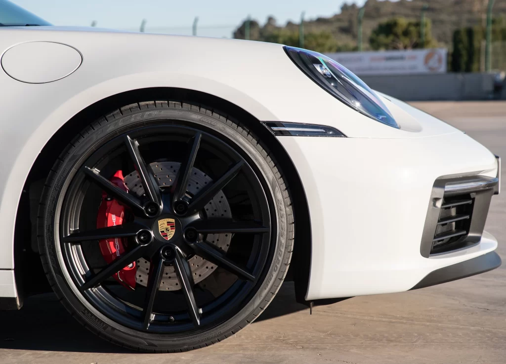 White Porsche Sports Car Wheel Caliper Detail