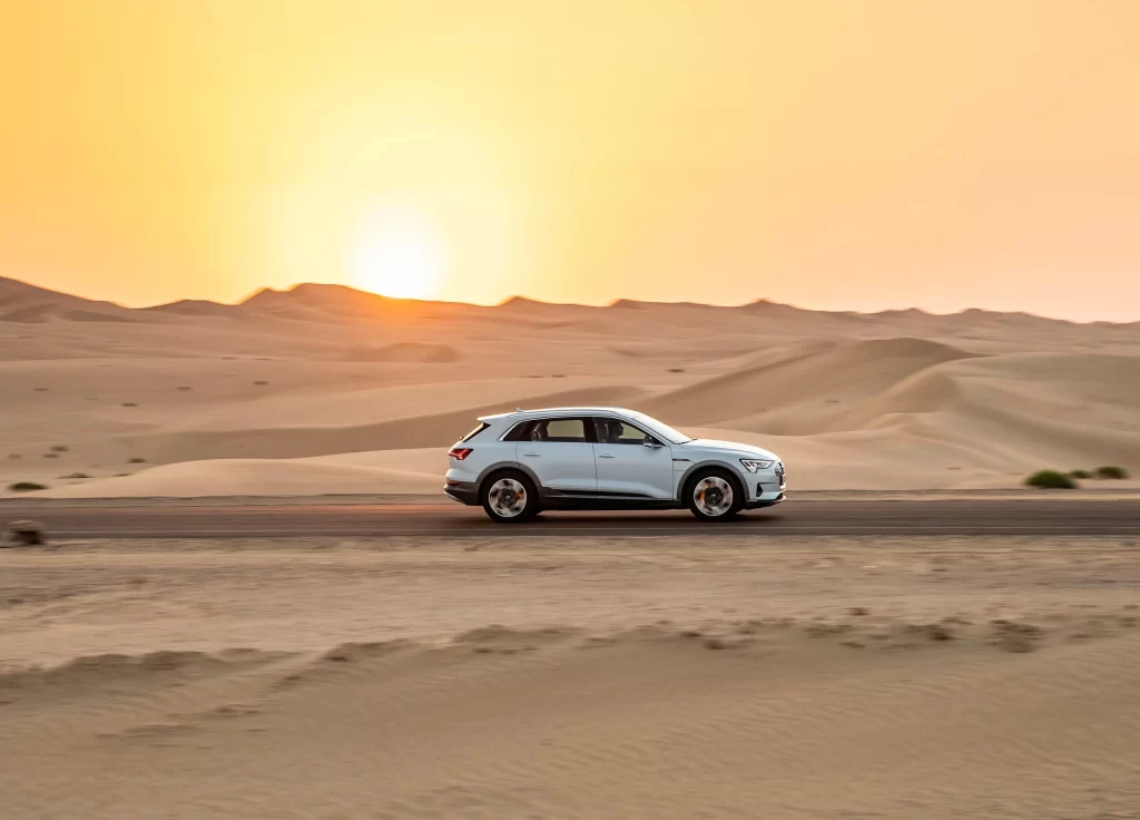 White SUV Desert Landscape Driving View
