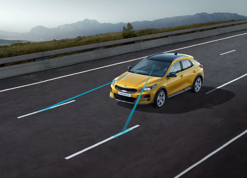 Yellow Kia Hatchback Highway View