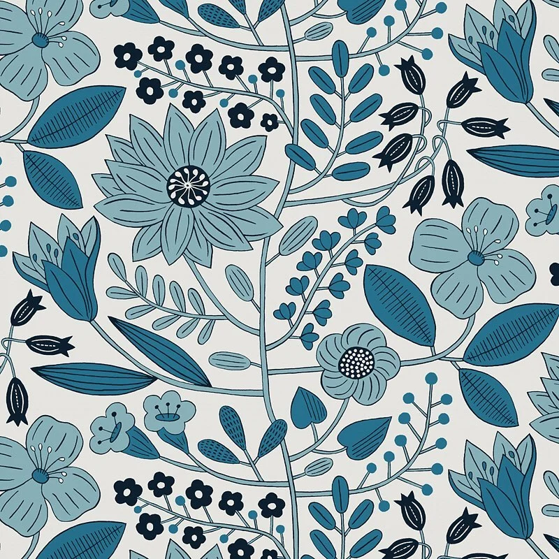 Nancy Wolff Blue floral and leaf patterns on a light background