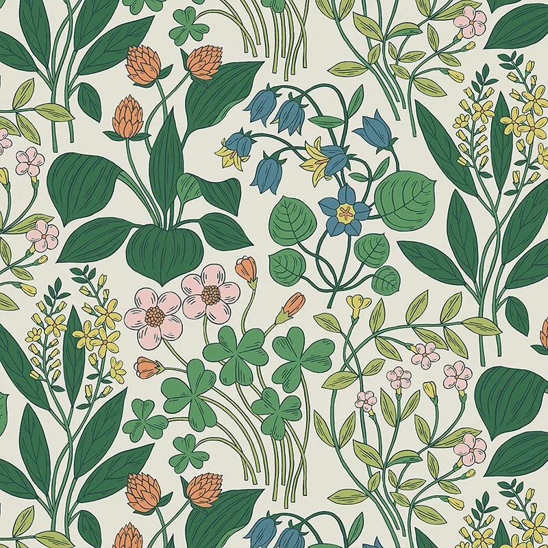 Nancy Wolff Green leaves and flowers in shades of orange, blue, pink, and yel