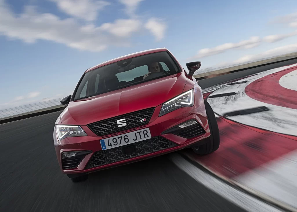 Red Cupra Hatchback Race Track Front View
